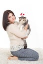 Beautiful young woman holding a cat, isolated against white background Royalty Free Stock Photo