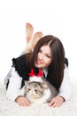 Beautiful young woman holding a cat, isolated against white background Royalty Free Stock Photo