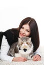 Beautiful young woman holding a cat, isolated against white background Royalty Free Stock Photo