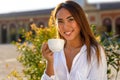 Beautiful young woman holding a cup of coffee or tea Royalty Free Stock Photo