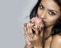 Beautiful young woman holding cupcake Royalty Free Stock Photo