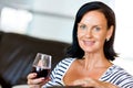 Beautiful young woman holding glass with red wine Royalty Free Stock Photo