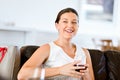 Beautiful young woman holding glass with red wine Royalty Free Stock Photo