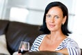 Beautiful young woman holding glass with red wine Royalty Free Stock Photo