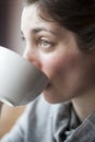 Beautiful Young Woman Holding Her Morning Cup of Coffee Royalty Free Stock Photo