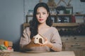 Beautiful young woman holding house model Royalty Free Stock Photo