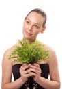 Beautiful young woman holding plant growing Royalty Free Stock Photo