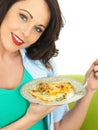 Beautiful Young Woman Holding a Plate of Delicious Cannelloni Spinach Pasta
