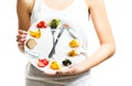 Beautiful young woman holding a plate with food, diet concept Royalty Free Stock Photo