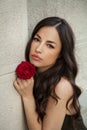 Beautiful lady holding red rose