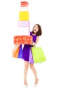 Beautiful young woman holding shopping bag and gift boxes Royalty Free Stock Photo