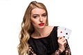 Beautiful young woman holding two ace of cards in her hand isolated on black background Royalty Free Stock Photo
