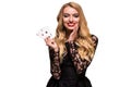 Beautiful young woman holding two ace of cards in her hand isolated on black background Royalty Free Stock Photo