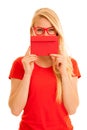 Beautiful young woman holds red envelope - a love letter for va Royalty Free Stock Photo