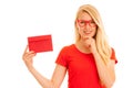 Beautiful young woman holds red envelope - a love letter for va Royalty Free Stock Photo