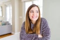 Beautiful young woman at home smiling looking side and staring away thinking Royalty Free Stock Photo