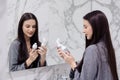 Positive woman doing her self care routine in bathroom Royalty Free Stock Photo