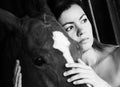 Beautiful young woman with a horse, black and white Royalty Free Stock Photo