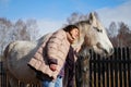 Beautiful young woman with a horse in the country Royalty Free Stock Photo