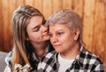 Beautiful young woman hugs her mother. Close-up portrait Royalty Free Stock Photo