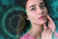 Beautiful young woman and illustration of zodiac wheel with astrological signs on dark background