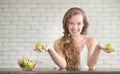 Beautiful young woman in joyful postures with salad bowl