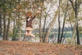 Beautiful young woman jumping in a city park Royalty Free Stock Photo