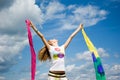 Beautiful young woman jumping on field in summer Royalty Free Stock Photo