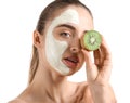 Beautiful young woman with kiwi facial mask on white background