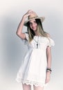 Beautiful young woman in a lace dress and a white cowboy hat Royalty Free Stock Photo