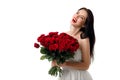 Beautiful young woman with a large bouquet of red roses Royalty Free Stock Photo