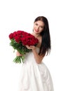 Beautiful young woman with a large bouquet of red roses Royalty Free Stock Photo