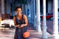 Beautiful young woman laughing with cellphone and earphones Royalty Free Stock Photo