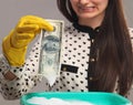 Beautiful young woman launder shady money (illegal cash, dollars Royalty Free Stock Photo