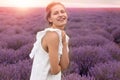 Beautiful young woman in lavender field on summer day Royalty Free Stock Photo