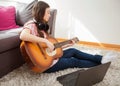 Woman learn playing classical guitar