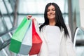 Beautiful woman leaving the mall with plenty of shopping bags Royalty Free Stock Photo