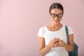 Beautiful young woman listening to music on color background Royalty Free Stock Photo