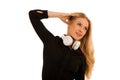 Beautiful young woman listens to the music on headphones and dan Royalty Free Stock Photo