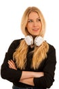 Beautiful young woman listens to the music on headphones and dan Royalty Free Stock Photo