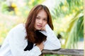 Beautiful young woman with long hair, Asian, posing, looking into the camera smiling happily on a path made of bamboo After coming Royalty Free Stock Photo