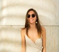 Beautiful young woman with long hair and sunglasses. Positive emotional portrait of a pretty smiling girl Royalty Free Stock Photo