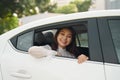 Beautiful young woman, looks out the window a white car Royalty Free Stock Photo