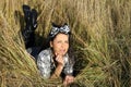 Beautiful young woman lying on field Royalty Free Stock Photo