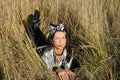 Beautiful young woman lying on field Royalty Free Stock Photo