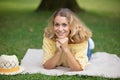 Beautiful young woman lying on field Royalty Free Stock Photo