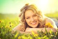 Beautiful young woman lying on a field Royalty Free Stock Photo