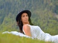 Beautiful young woman lying on a field Royalty Free Stock Photo