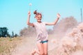 Beautiful Young Woman lying on the field in green grass and blowing dandelion. Outdoors. Enjoy Nature. Healthy Smiling Girl on spr Royalty Free Stock Photo