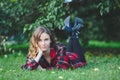 Beautiful young woman lying on a green grass Royalty Free Stock Photo